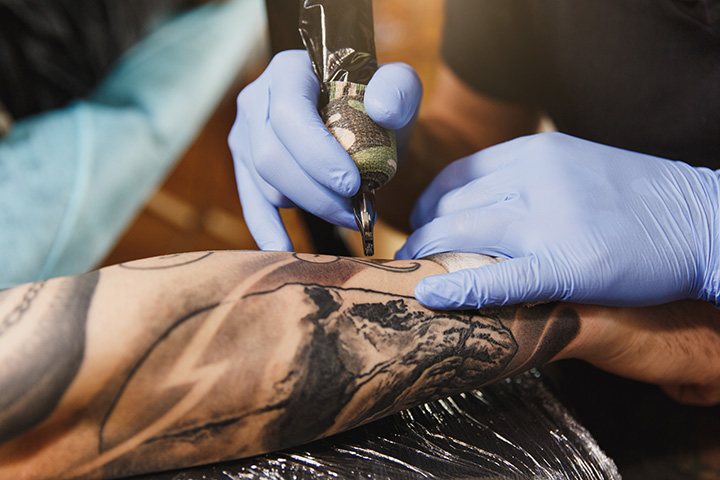 Woman unable to bend arm after botched tattoo job